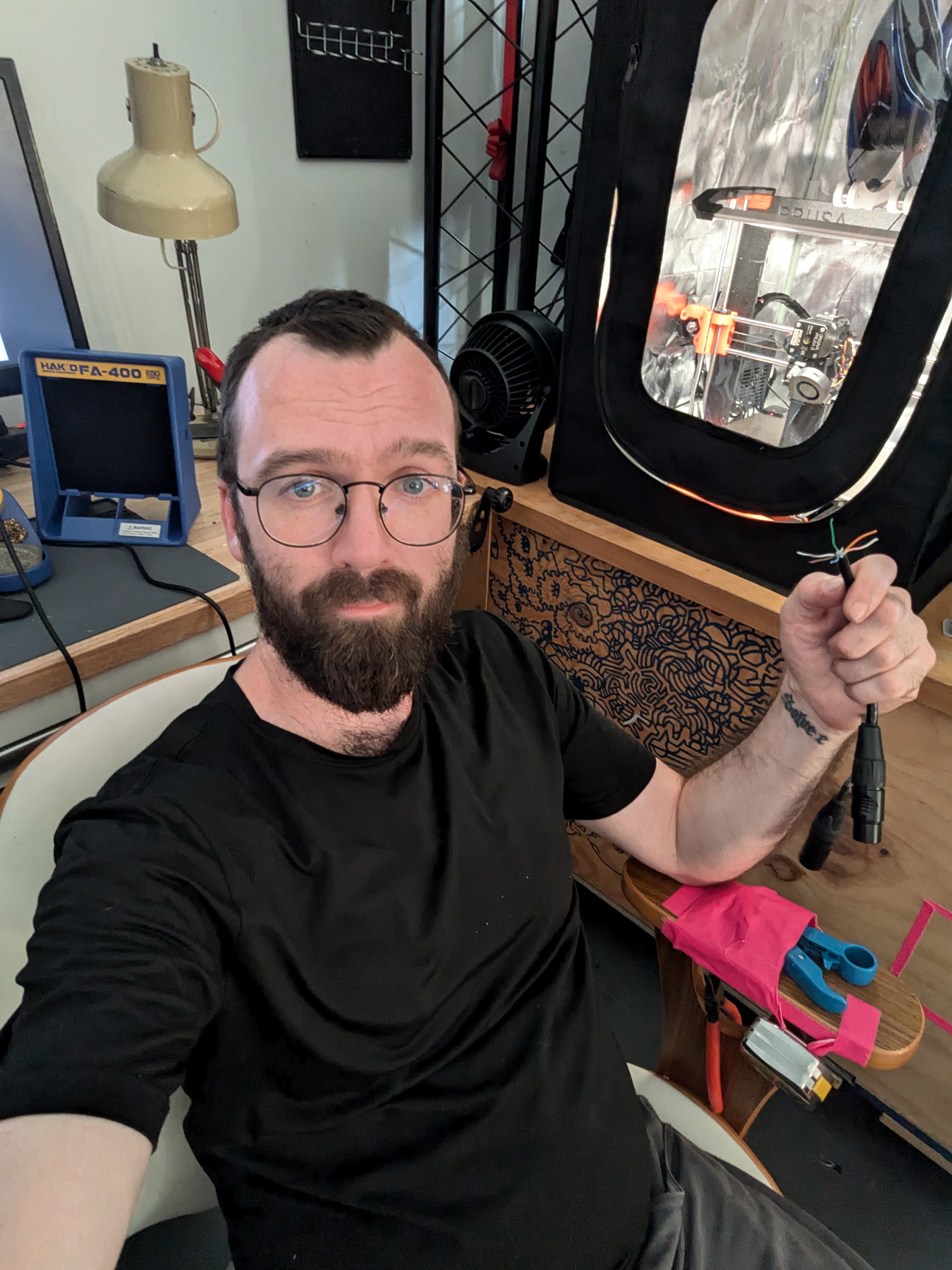 Phil making custom cables on a Coldplay tour